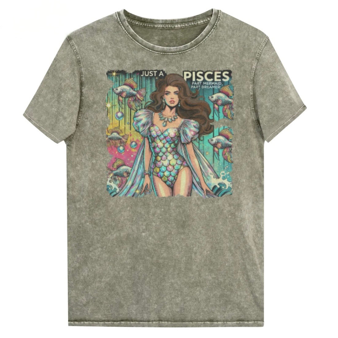 Flatlay of a unisex army green denim wash vintage t-shirt with a retro pop-art Pisces graphic featuring a brunette woman in a fish-scale dress, with fishes and bubbles backdrop, captioned ‘Just a Pisces, Part Mermaid, Part Dreamer'. Branded RedBlonde in red on inside neck and right shoulder