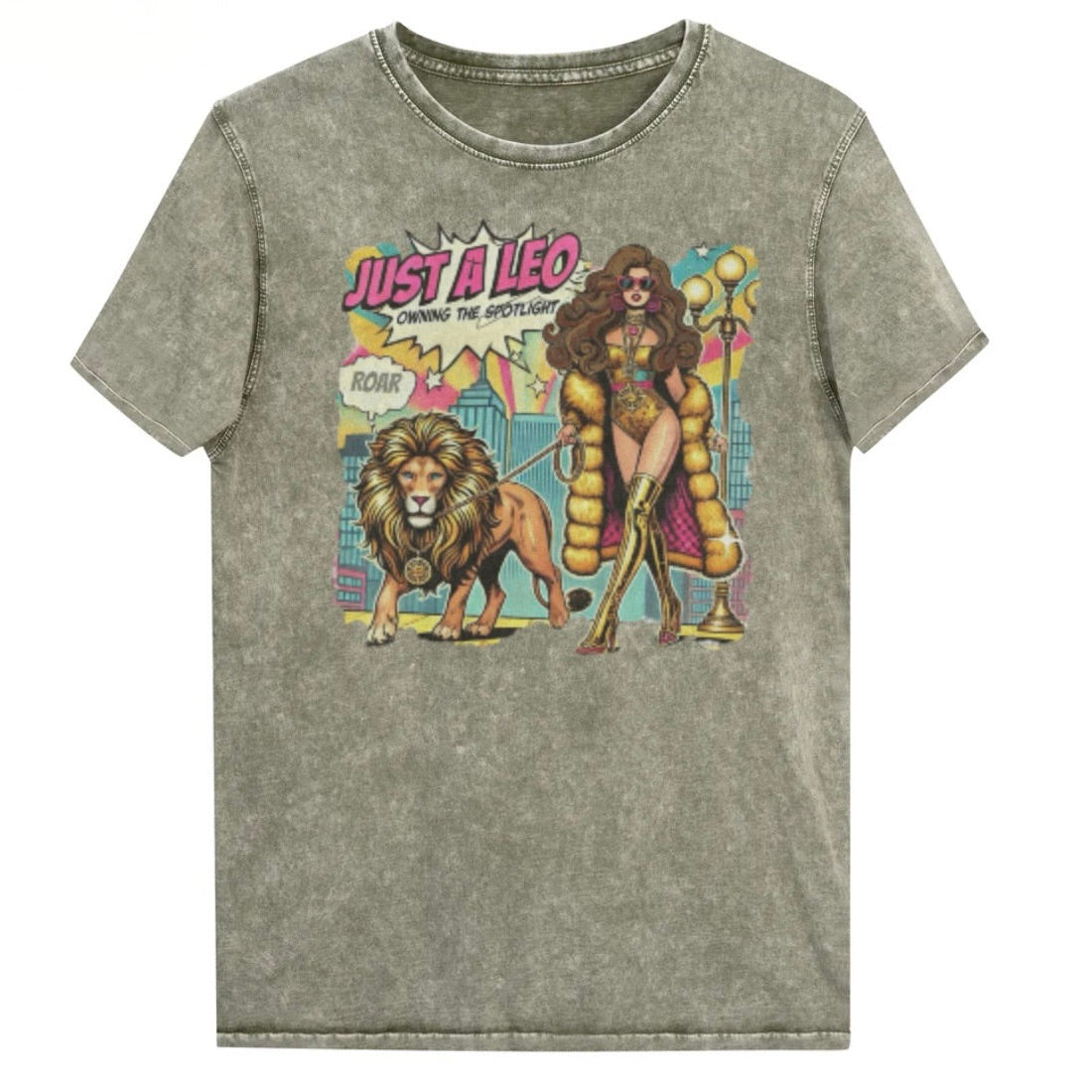 Flatlay of a unisex army green denim wash vintage t-shirt with a retro pop-art Brunette Leo graphic featuring a long haired brunette woman in a gold swimsuit, gold over the knee boots, gold medallion and long fur coat, walking a lion on a leash wearing a gold medallion, with a caption bubble 'Roar', with a city and round bulb street lights in the background captioned ‘Just a Leo, Owning the Spotlight'. Branded RedBlonde in red on inside neck and right shoulder