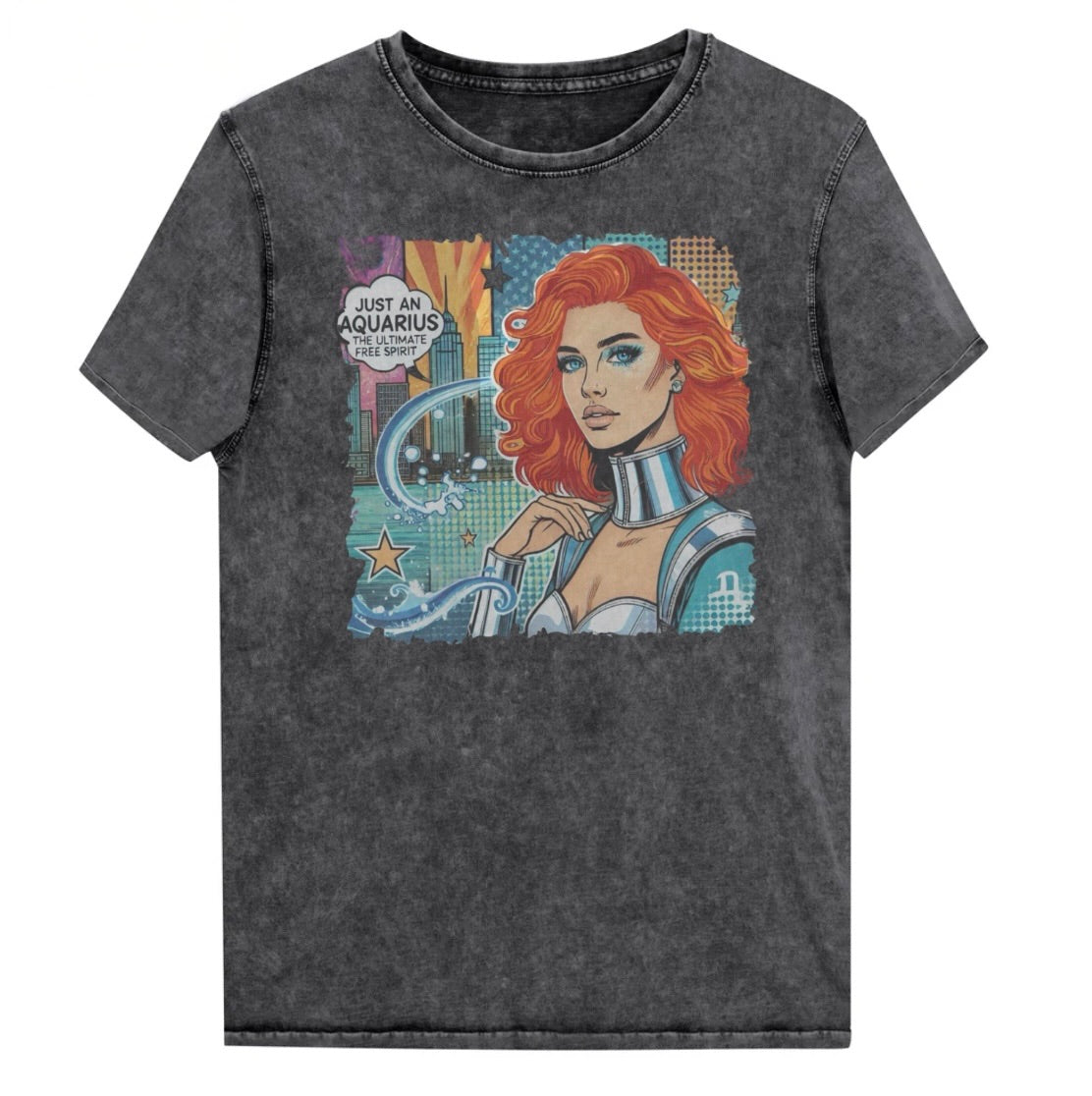 Flatlay of a unisex black denim wash vintage t-shirt with a retro pop-art Aquarius graphic showing the head and shoulders of a redhead woman with blue highlights wearing a sci-fi type silver choker and outfit, with a city background with tentacles and stars captioned, "Just an Aquarius, the ultimate free spirit". Branded Redblonde in red on inside neck and right shoulder