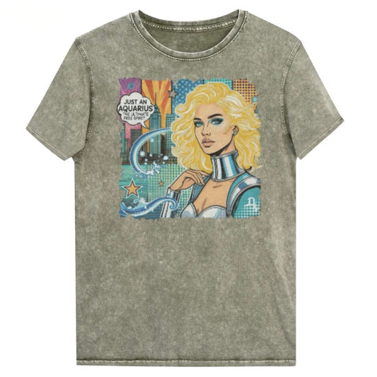 Flatlay of a army green denim vintage denim-wash unisex t-shirt with a retro pop-art Aquarius graphic showing the head and shoulders of a blonde woman with blue highlights wearing a sci-fi type silver choker and outfit, with a city background with tentacles and stars captioned, "Just an Aquarius, the ultimate free spirit". Branded Redblonde in red on inside neck and right shoulder