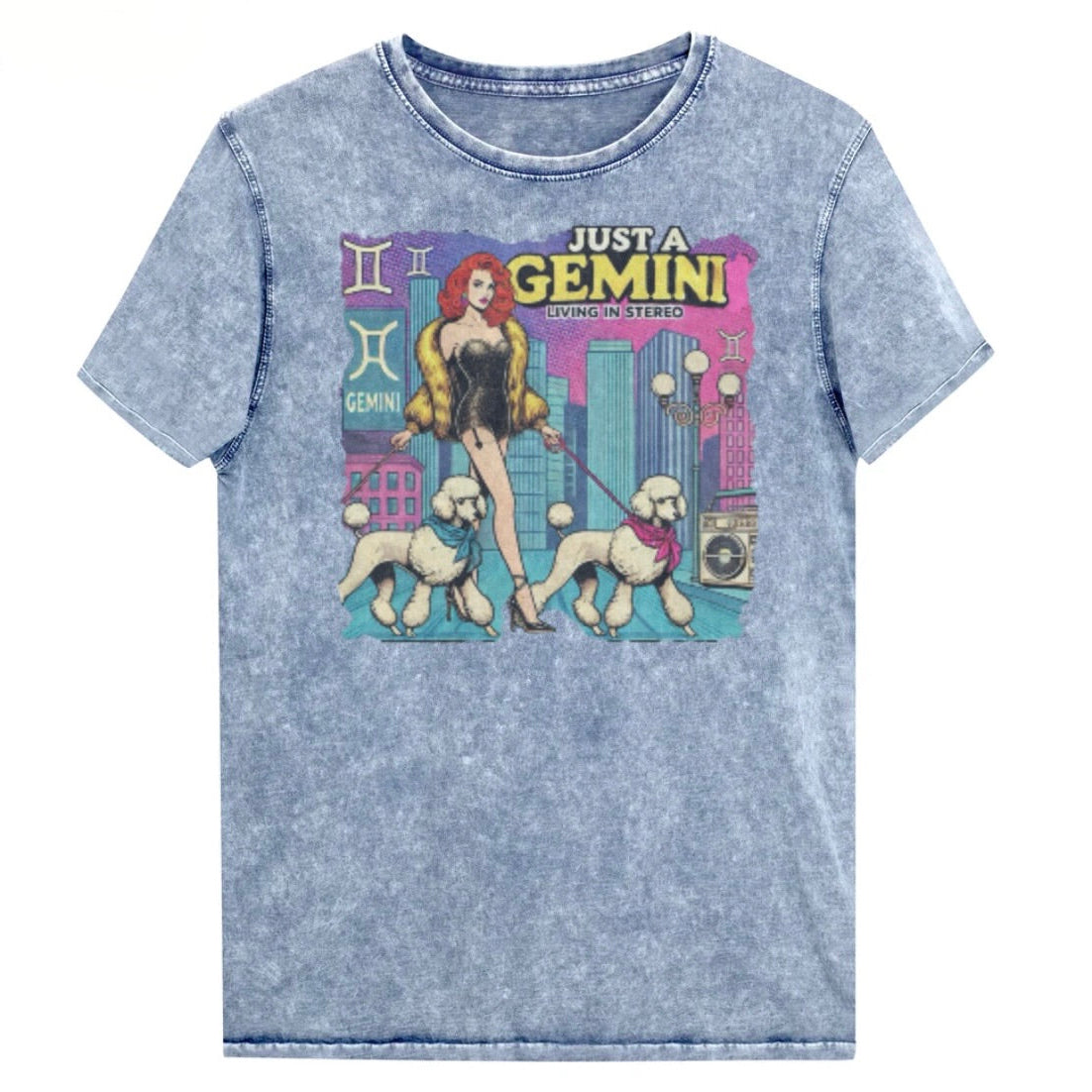 Flatlay of a unisex blue denim wash vintage t-shirt with a retro pop-art Gemini graphic featuring a redhead woman, in a short catsuit and fur coat walking two poodle dogs with neck scarfs with a city backdrop and a gettoblaster ‘Just a Gemini, Living in Stereo'. Branded RedBlonde on inside neck and right shoulder
