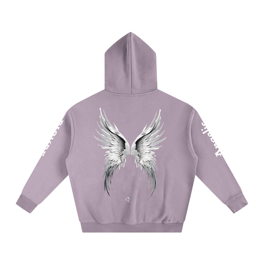Back view of a lavender hoodie featuring large silver angel wings printed across the back, with black RedBlonde signature logo underneath. Each sleeve features gothic New Rockstar font graphic text  one sleeve says 'Angelic' and the other 'Blonde' 