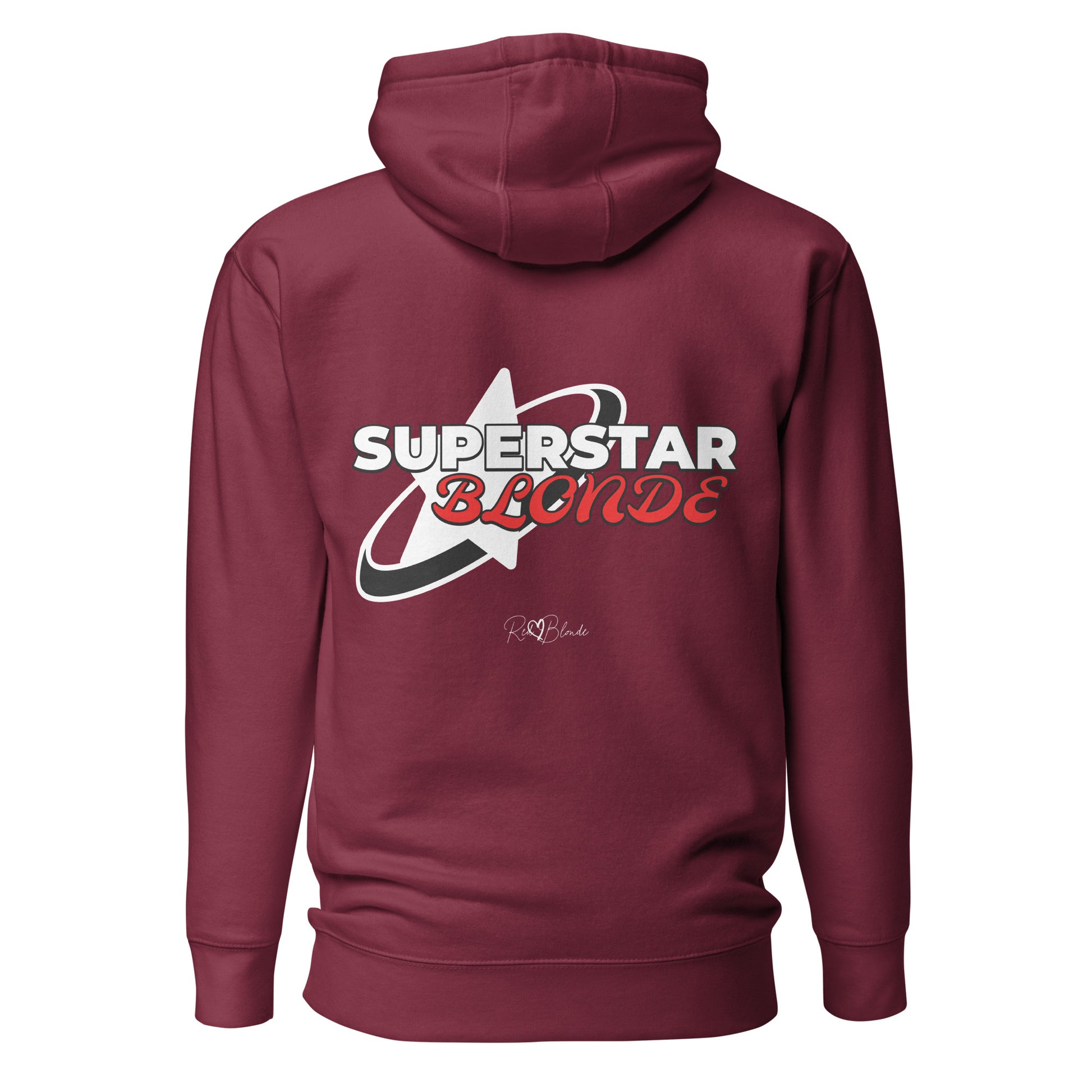 A maroon unisex pullover hoodie with a large back graphic design. The print features a bold white star with a swoosh around it and the words “SUPERSTAR BLONDE” in white and red retro-style Monsierrat and Molle lettering. The design also includes a small signature logo “R & B Blonde” underneath. Branded RedBlonde on inside neck and right sleeve