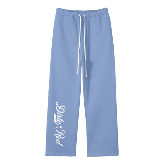 Medium blue relaxed-fit straight joggers with white drawstrings and vintage-style “Dirty Red” milkstore script printed vertically down the leg — bold, effortless and unmistakably RedBlonde.