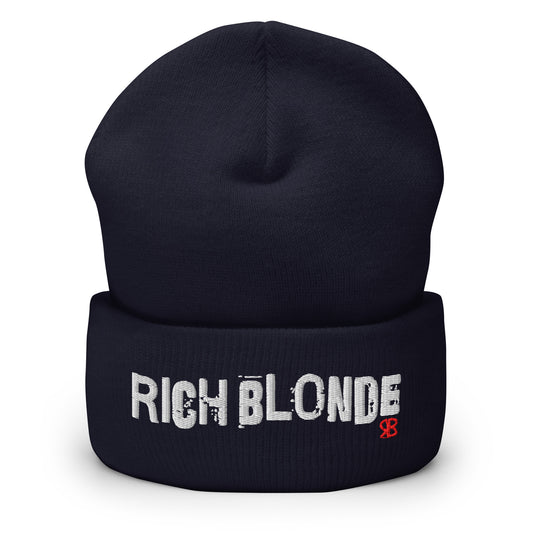 Black cuffed beanie featuring bold white embroidered text “RICH BLONDE” across the front and a small red RB logo detail on the fold.