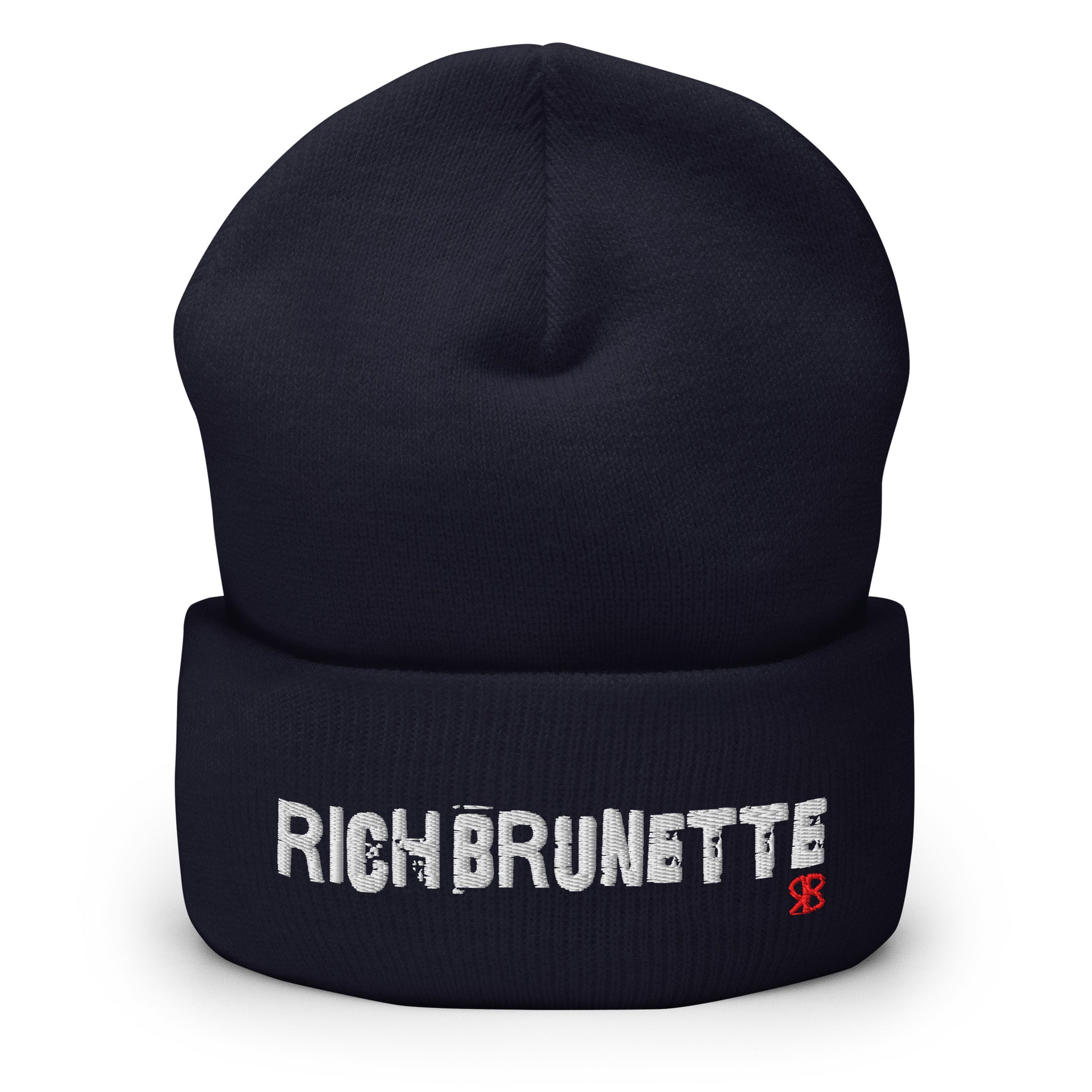 Navy Rich Brunette knitted beanie with the embroidered phrase “Rich Brunette” in white script and a small red RB logo on the fold-over cuff, displayed against a clean white background.