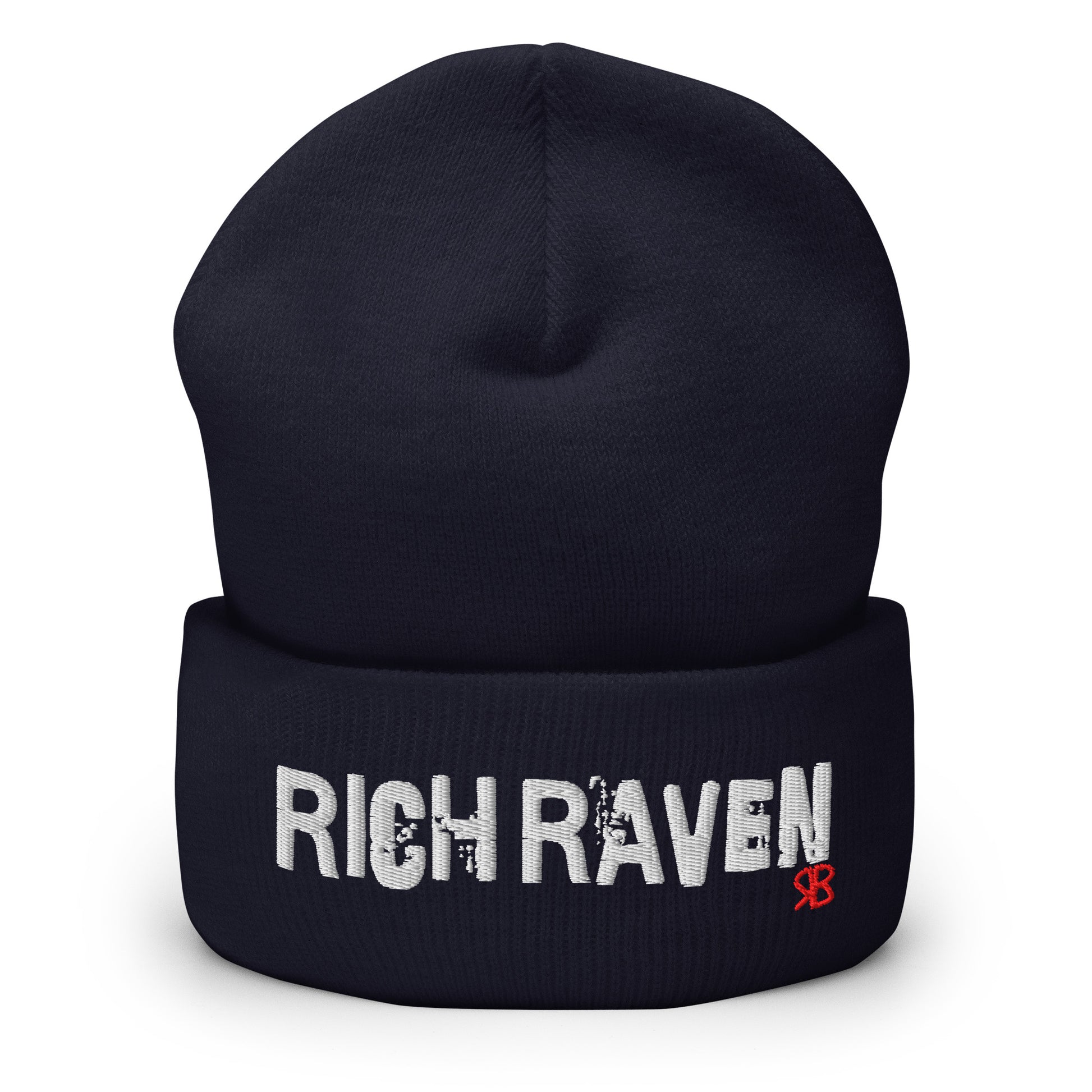 Navy knitted beanie with the embroidered phrase “Rich Raven” in white script and a small red RB logo on the fold-over cuff, displayed against a clean white background.