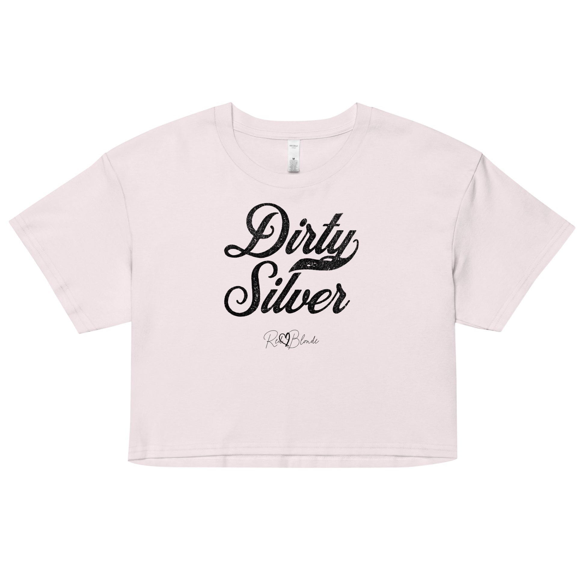 Orchid women’s crop top featuring the phrase “Dirty Silver” in bold, black milkstore vintage-style script across the chest. Below the phrase, the brand name “RedBlonde” is printed in a smaller, elegant handwritten font.
