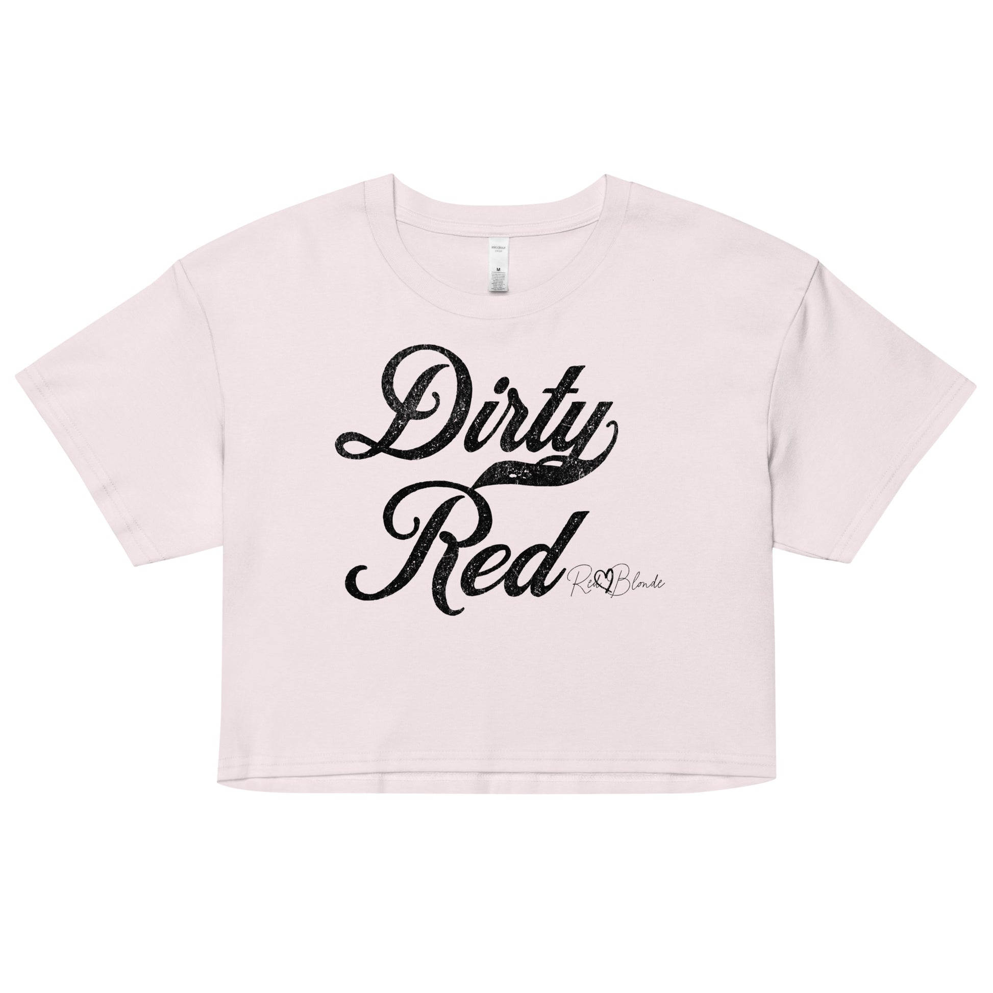 Orchid women’s crop top featuring the phrase “Dirty Red” in bold, black milkstore vintage-style script across the chest. Below the phrase, the brand name “RedBlonde” is printed in a smaller, elegant handwritten font.