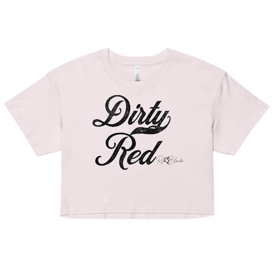 Orchid women’s crop top featuring the phrase “Dirty Red” in bold, black milkstore vintage-style script across the chest. Below the phrase, the brand name “RedBlonde” is printed in a smaller, elegant handwritten font.