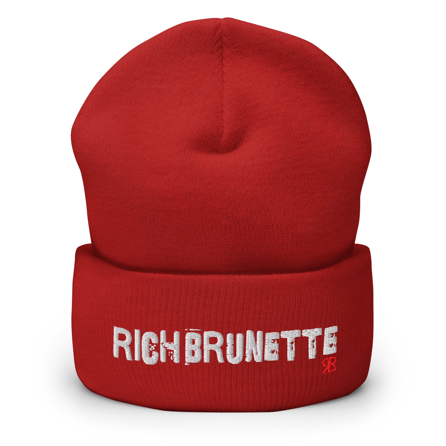 Red Rich Brunette knitted beanie with the embroidered phrase “Rich Brunette” in white script and a small red RB logo on the fold-over cuff, displayed against a clean white background.