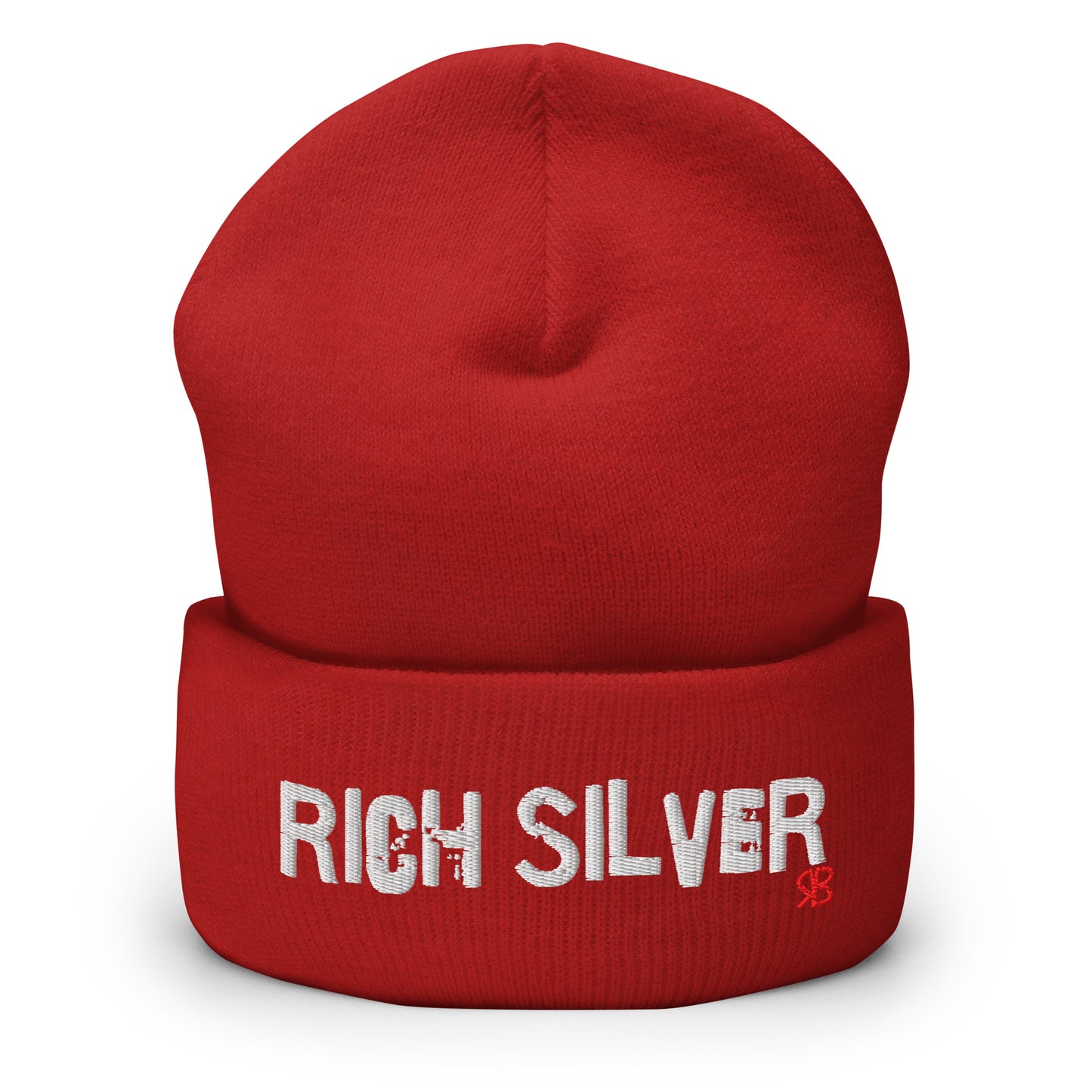 Red knitted beanie with the embroidered phrase “Rich Silver” in white script and a small red RB logo on the fold-over cuff, displayed against a clean white background.
