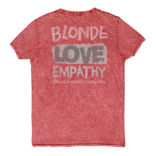 Red denim-style unisex t-shirt with a distressed vintage finish. The back features large faded text reading “Blonde Love Empathy” in white and grey block letters, with the phrase “Spread Kindness Every Day” printed beneath in smaller text. Signed off Red 'heart' Blonde. Branded RedBlonde in red on inside neck and right sleeve