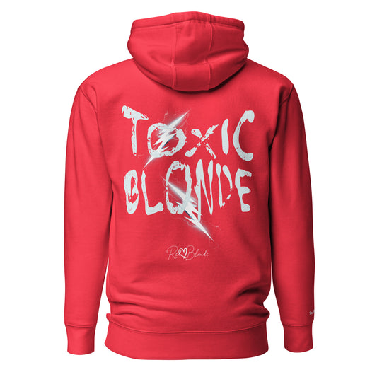 Back view of a garnet red unisex hoodie featuring bold distressed white Chainsaw Carnage text reading “Toxic Blonde” with lightning-style accents and the RedBlonde signature logo underneath. The design has an edgy, electric aesthetic.It features the text 'Blonde' embroidered on the front. Branded RedBlonde in red on right sleeve.