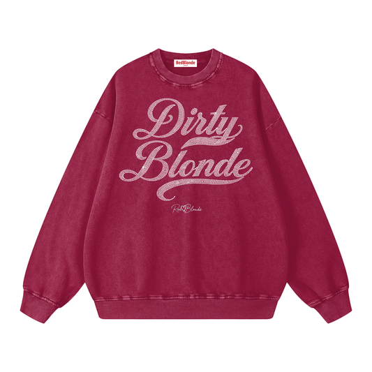 Red snow-wash oversized sweatshirt with a drop-shoulder fit, featuring a rhinestone-style “Dirty Blonde” Milkstore script graphic across the front and a small RedBlonde logo near the hem.