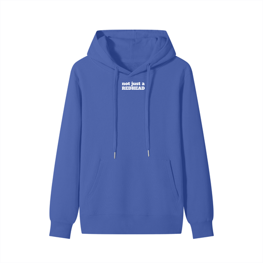 Front view of a royal blue hoodie with drawstrings and a front pocket. The chest features white Alfa Slab One text that reads “not just a REDHEAD.” 