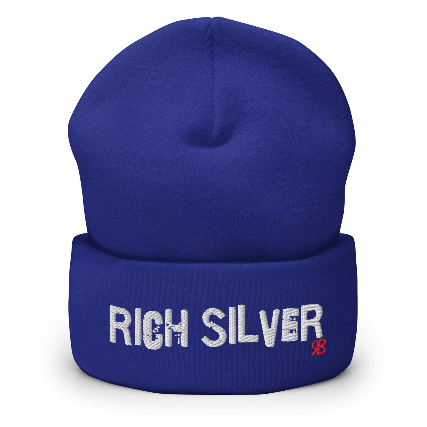 Royal blue knitted beanie with the embroidered phrase “Rich Silver” in white script and a small red RB logo on the fold-over cuff, displayed against a clean white background.