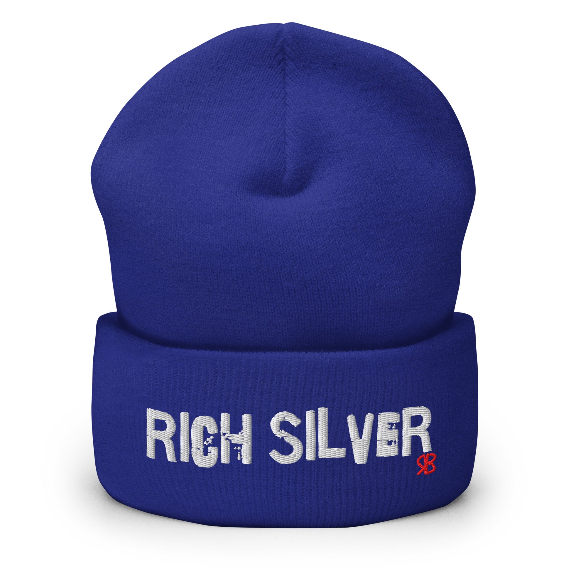 Royal blue knitted beanie with the embroidered phrase “Rich Silver” in white script and a small red RB logo on the fold-over cuff, displayed against a clean white background.