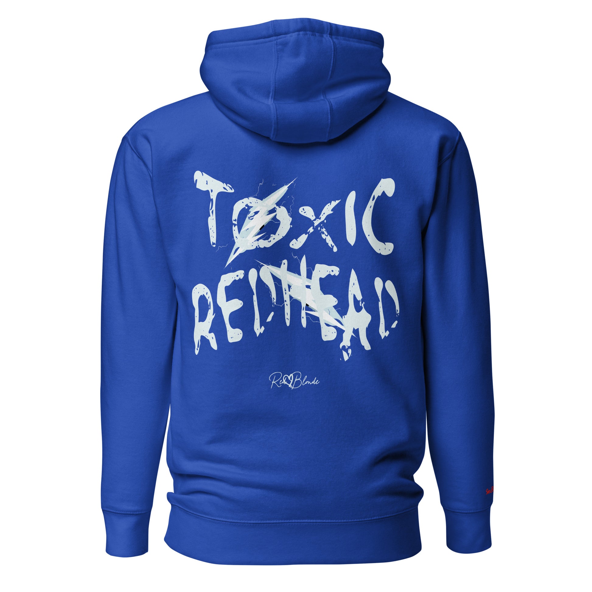 Back view of a Royal blue unisex hoodie featuring bold distressed white Chainsaw Carnage text reading “Toxic Redhead” with lightning-style accents and the RedBlonde signature logo underneath. The design has an edgy, electric aesthetic.It features the text 'Blonde' embroidered on the front. Branded RedBlonde in red on right sleeve.