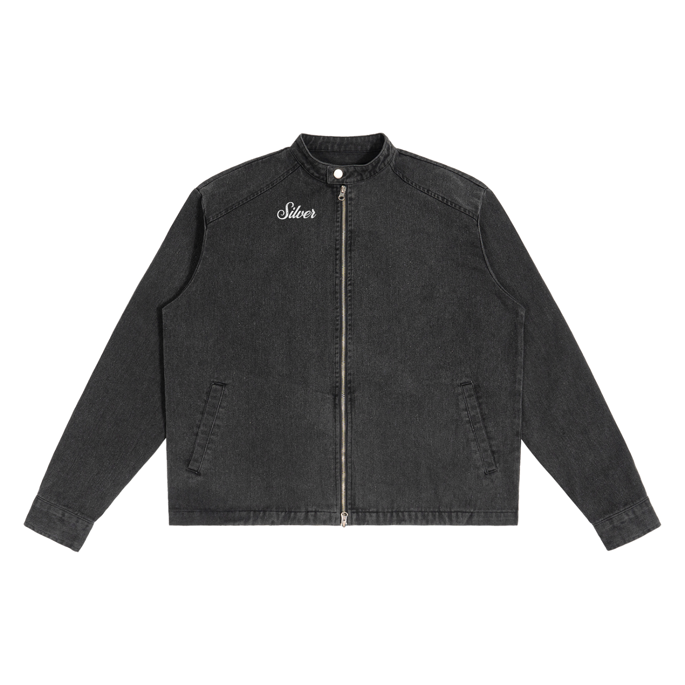A washed-black denim jacket with a straight, boxy cut and a stand collar. The front features a full silver zip, two slanted pockets, and white embroidered text on the left chest that reads "Silvere" in Milkstore script 