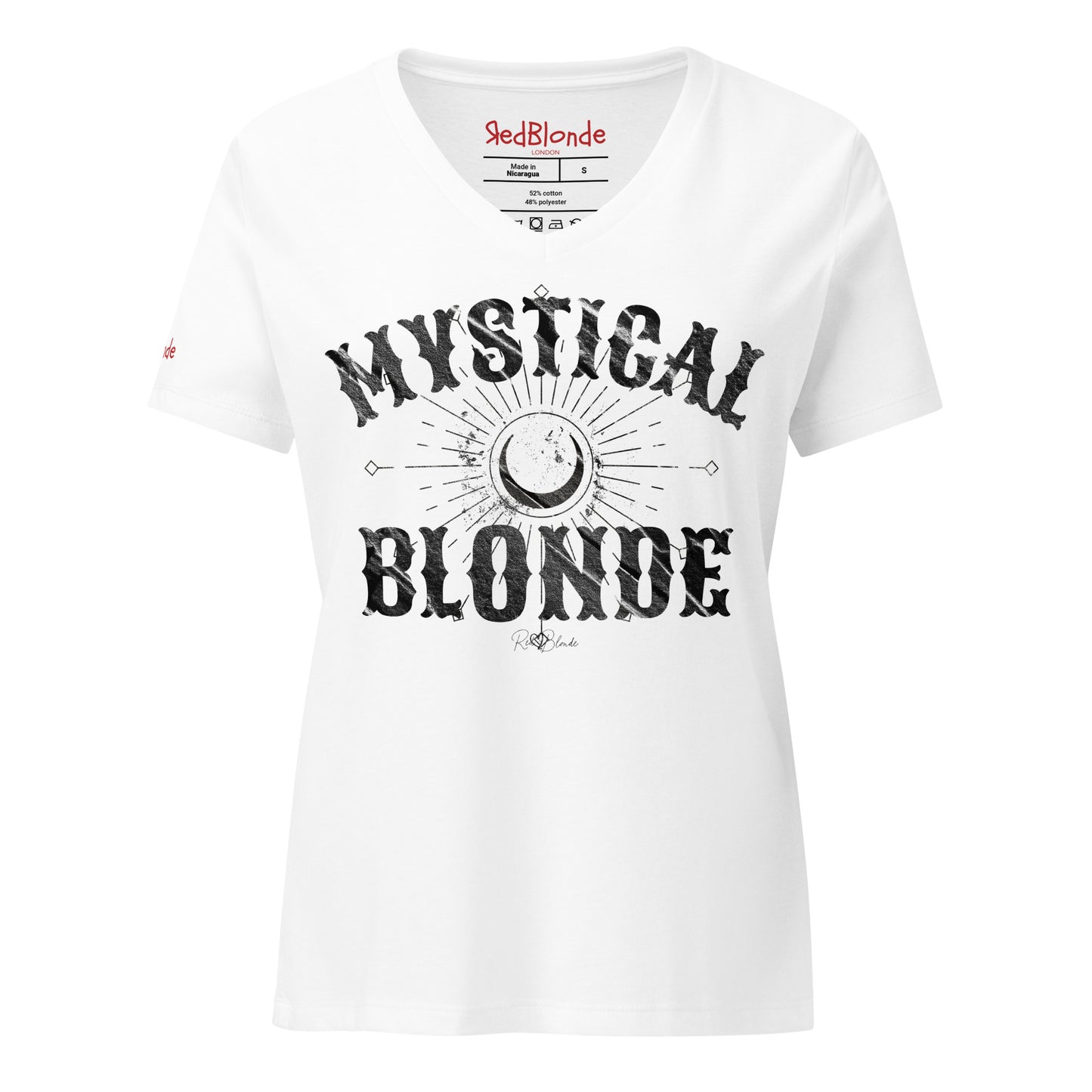 White women’s V-neck T-shirt with bold black distressed Sancreek text reading “MYSTICAL BLONDE”. Between the words is a large crescent moon surrounded by radiating sunburst lines and small arrow-like details, creating a mystical, celestial design. The “RedBlonde” brand signature is printed below the word “BLONDE,” while the neckline shows the RedBlonde logo and garment care information in red and black. Redblonde branding on the right sleeve