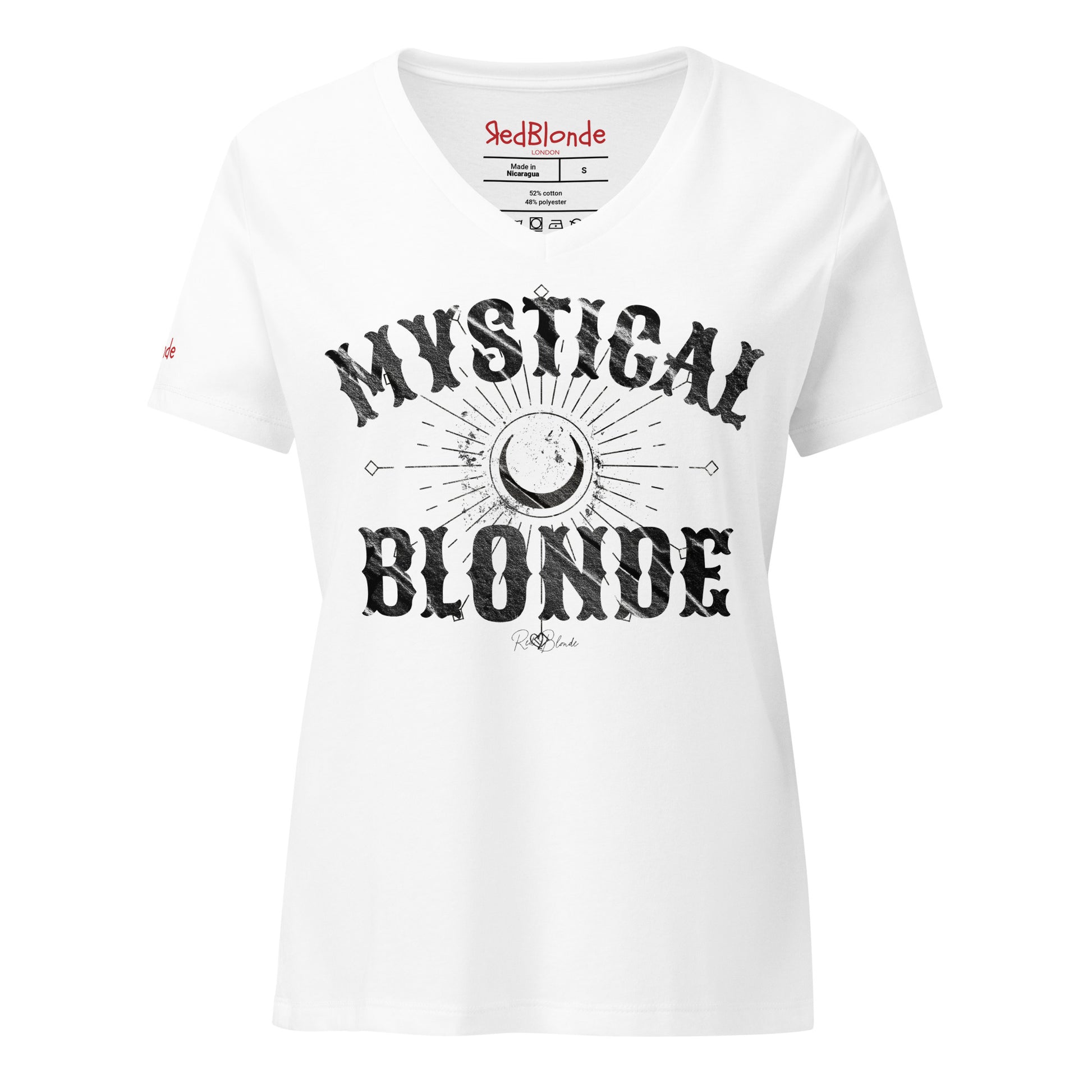 White women’s V-neck T-shirt with bold black distressed Sancreek text reading “MYSTICAL BLONDE”. Between the words is a large crescent moon surrounded by radiating sunburst lines and small arrow-like details, creating a mystical, celestial design. The “RedBlonde” brand signature is printed below the word “BLONDE,” while the neckline shows the RedBlonde logo and garment care information in red and black. Redblonde branding on the right sleeve