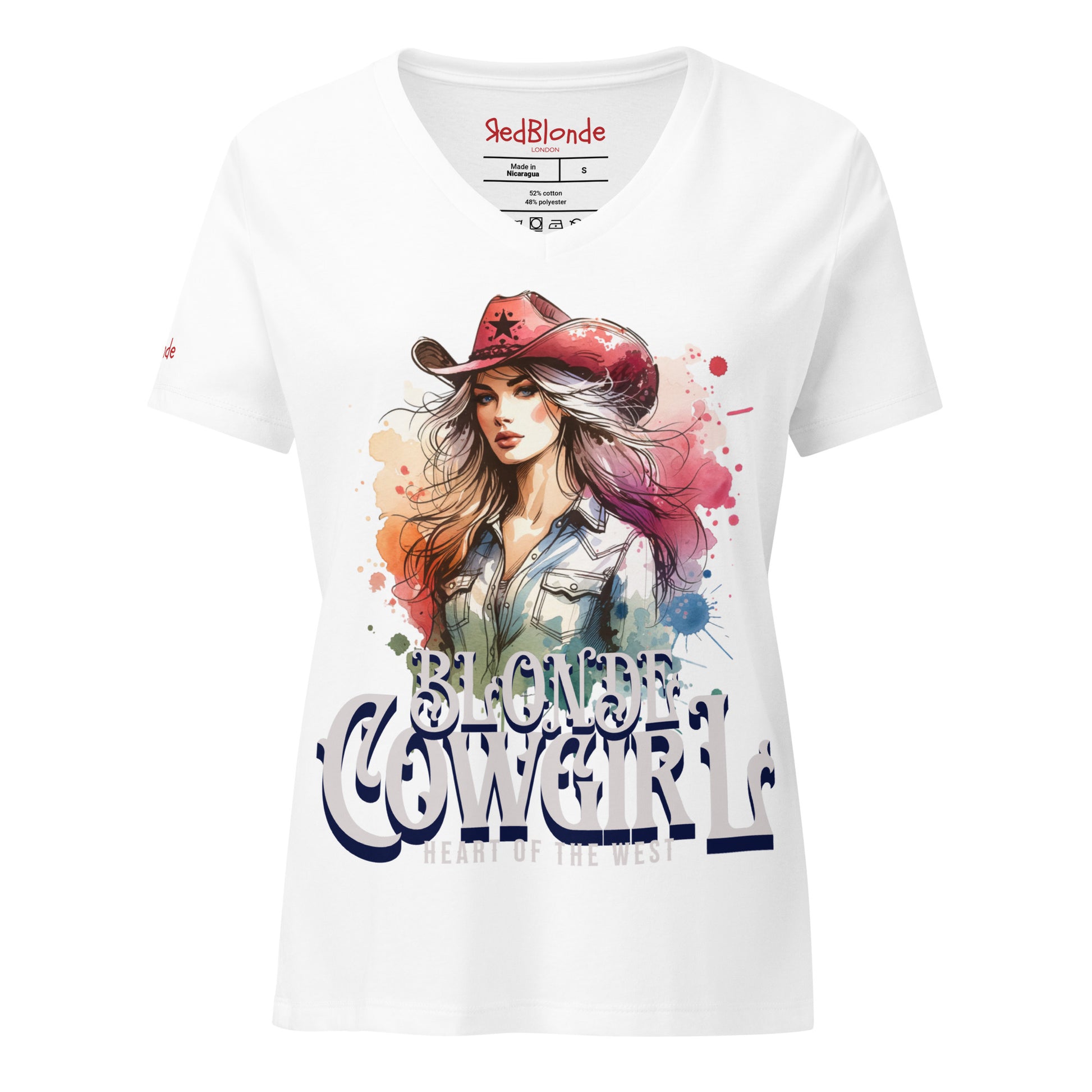 White V-neck women’s T-shirt with a colorful graphic of a stylish blonde cowgirl wearing a red cowboy hat and denim shirt, paired with the bold text “Blonde Cowgirl” and “Heart of the West” in white western-style font. Branded RedBlonde on inside neck and right sleeve