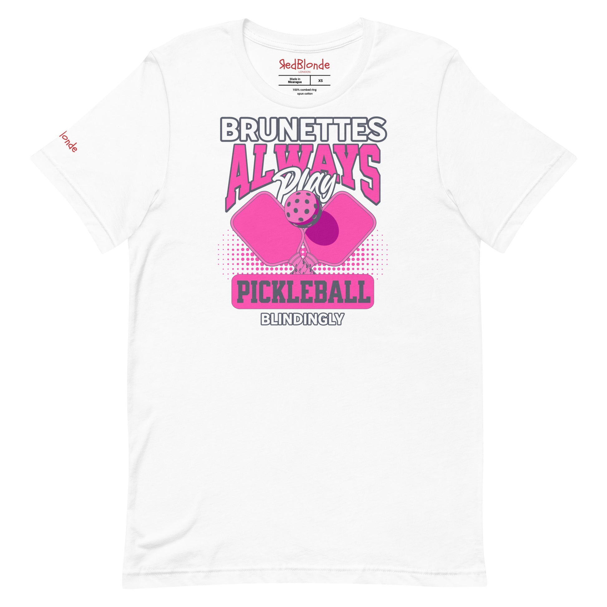 White unisex t-shirt with bold pink and white graphic that says "Brunettes Always Play Pickleball Blindingly," featuring two pink pickleball paddles and a ball. Branded RedBlonde on inside neck and right sleeve