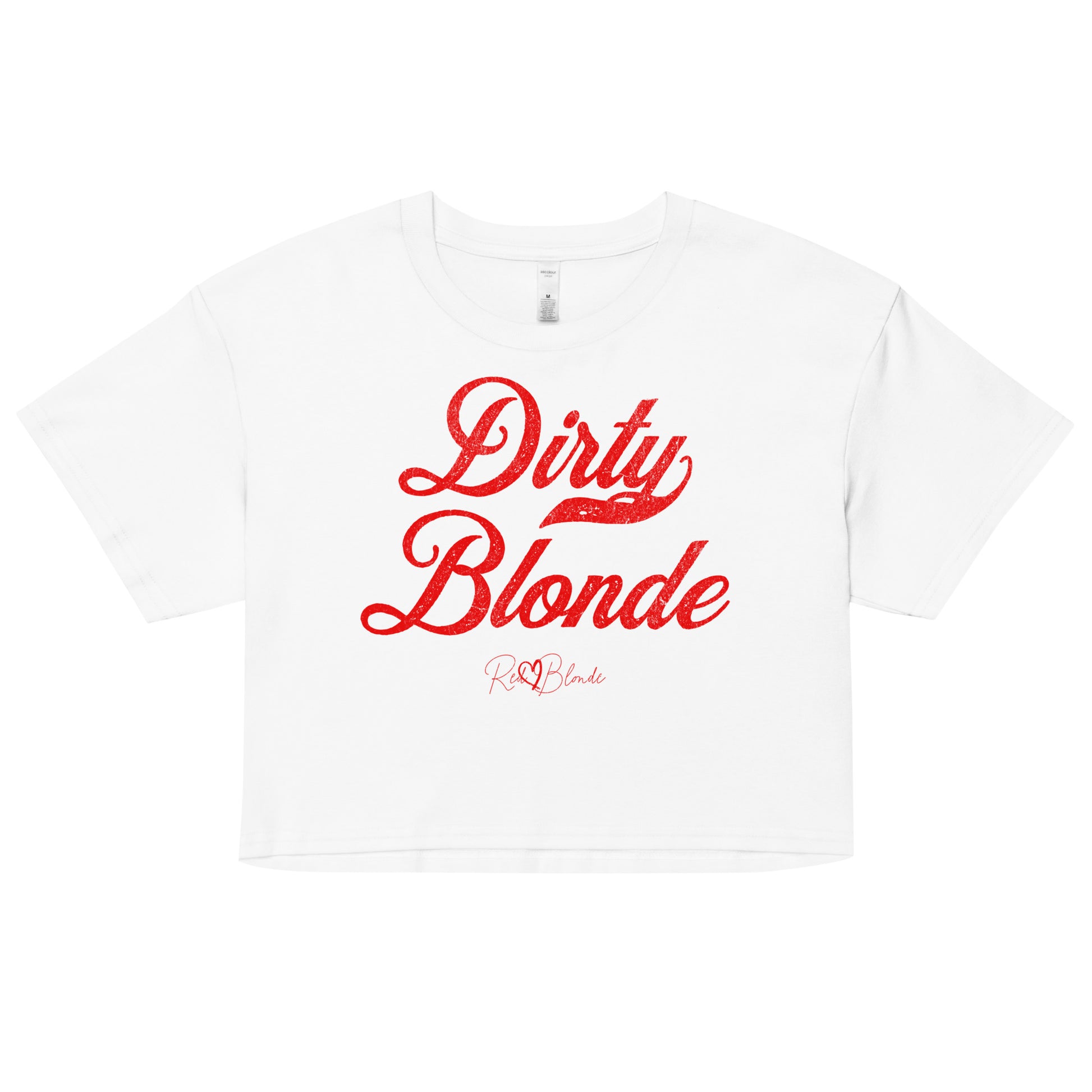 White women’s crop top featuring the phrase “Dirty Blonde” in bold, red milkstore vintage-style script across the chest. Below the phrase, the brand name “RedBlonde” is printed in a smaller, elegant handwritten font.
