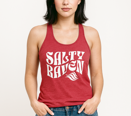 Woman with jet black hair wears a red soft racerback tank t-shirt with 'Salty Raven' play on words slogan in white retro wavy 70s font.  Branded RedBlonde London on revers