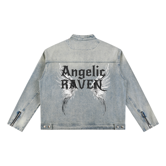 A light-wash denim jacket shown from the back on a white background. The sleeves have zippered cuffs, and the back features a large graphic with white angel wings and black gothic New Rocker style text reading “Angelic RAVEN.”