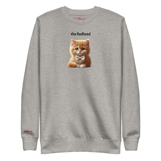 Flatlay of carbon grey relaxed fit unisex sweatshirt with a cute graphic of a redhead kitten wearing a bow-tie and the words 'the Redhead' linking to Red hair. Branded RedBlonde in red on inside neck and right cuff