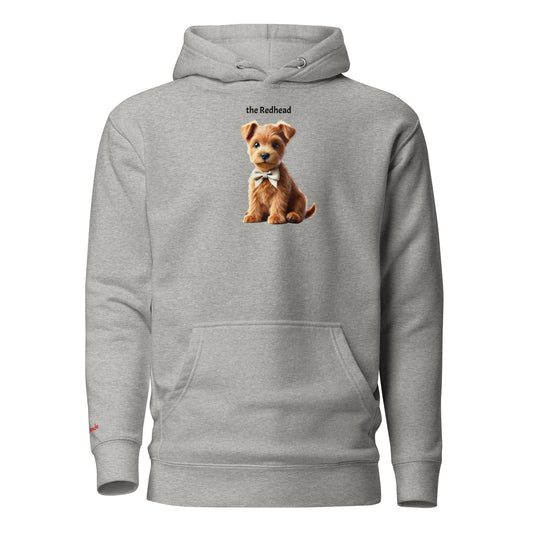 Flatlay of carbon grey relaxed fit unisex hoodie with a cute graphic of a Redhead Puppy  wearing a bow-tie and the words 'the Redhead' linking to Red hair. Branded RedBlonde in red on inside neck and right cuff