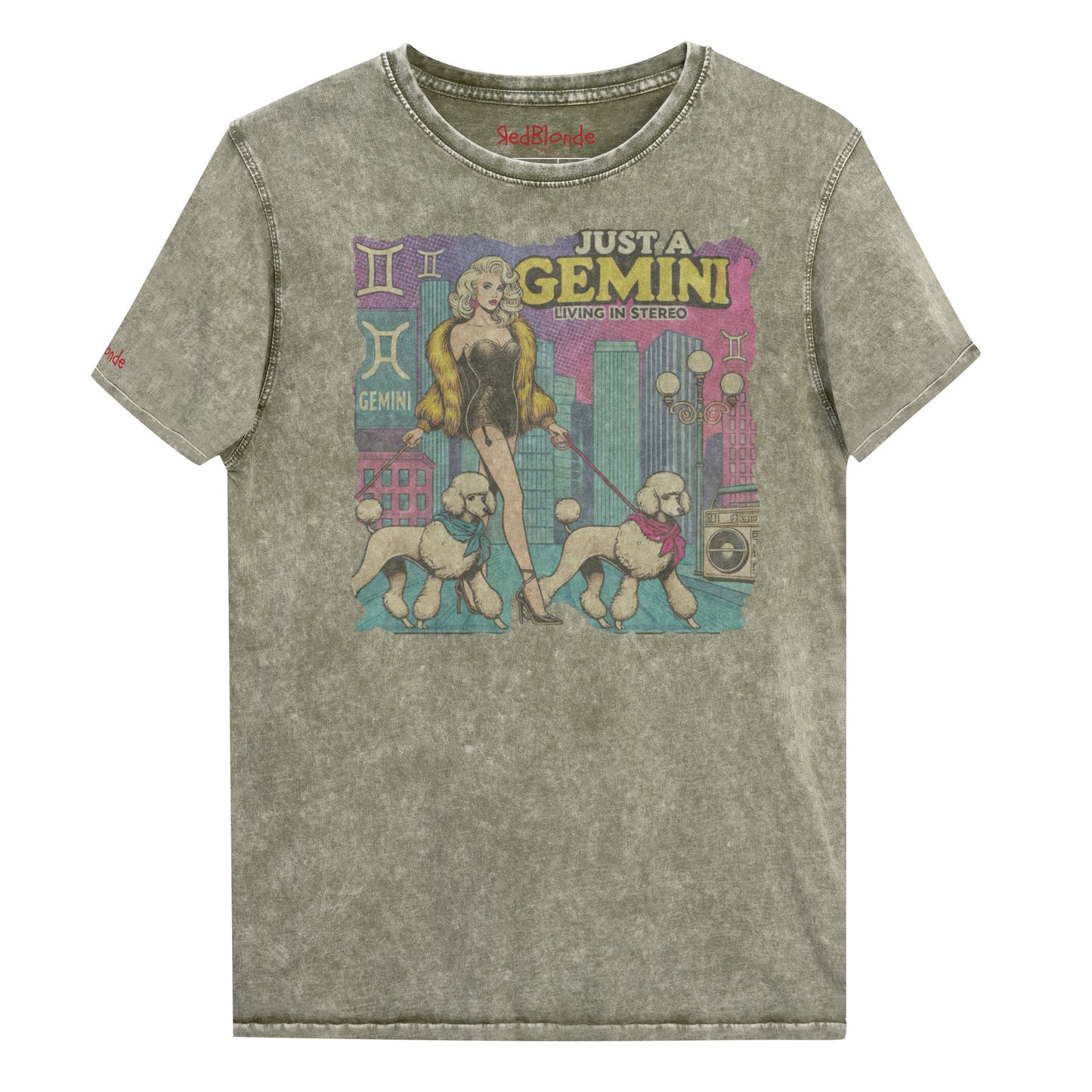 Flatlay of a unisex army green denim wash vintage t-shirt with a retro pop-art Gemini graphic featuring a blonde woman, in a short catsuit and fur coat walking two poodle dogs with neck scarfs with a city backdrop and a gettoblaster ‘Just a Gemini, Living in Stereo'. Branded RedBlonde on inside neck and right shoulder