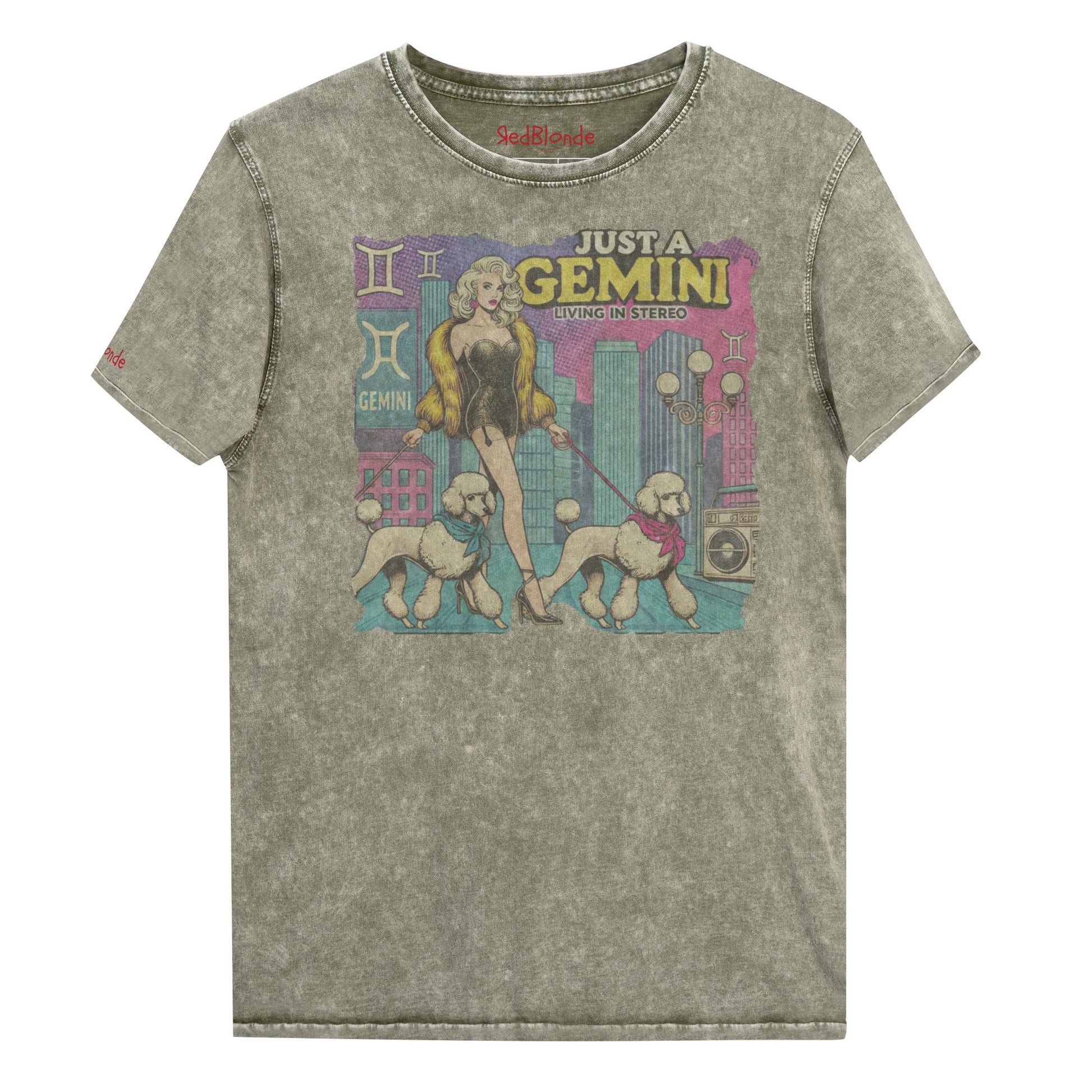 Flatlay of a unisex army green denim wash vintage t-shirt with a retro pop-art Gemini graphic featuring a blonde woman, in a short catsuit and fur coat walking two poodle dogs with neck scarfs with a city backdrop and a gettoblaster ‘Just a Gemini, Living in Stereo'. Branded RedBlonde on inside neck and right shoulder