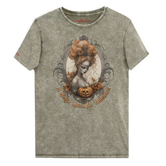 army green acid-wash unisex T-shirt featuring a gothic-style illustration of ginger-haired woman with an elaborate beehive hairstyle, framed by ornate scrollwork, autumn leaves, and a carved pumpkin. The design is captioned with the text ‘A Blonde Queen for Halloween’ in vintage Dark Angle lettering. Branded RedBlonde in red on inside neck and right sleeve