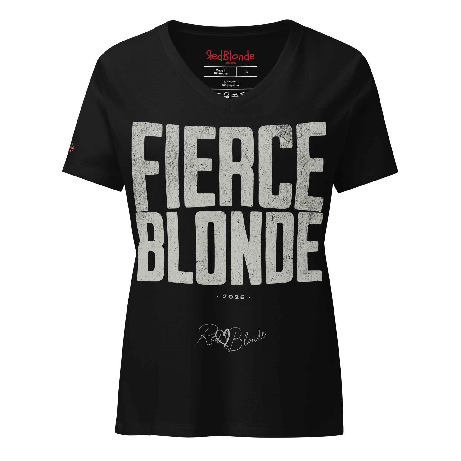 black women’s V-neck T-shirt featuring the bold black distressed text “FIERCE BLONDE” in large North Road capital letters across the chest. Beneath the text, the year “2025” is printed in small type, with the “RedBlonde” brand signature logo below it. The inner collar shows the “RedBlonde” brand name in red along with sizing and care details, and “RedBlonde” is also printed in small red letters on the right sleeve.