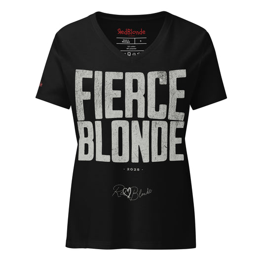 black women’s V-neck T-shirt featuring the bold black distressed text “FIERCE BLONDE” in large North Road capital letters across the chest. Beneath the text, the year “2025” is printed in small type, with the “RedBlonde” brand signature logo below it. The inner collar shows the “RedBlonde” brand name in red along with sizing and care details, and “RedBlonde” is also printed in small red letters on the right sleeve.