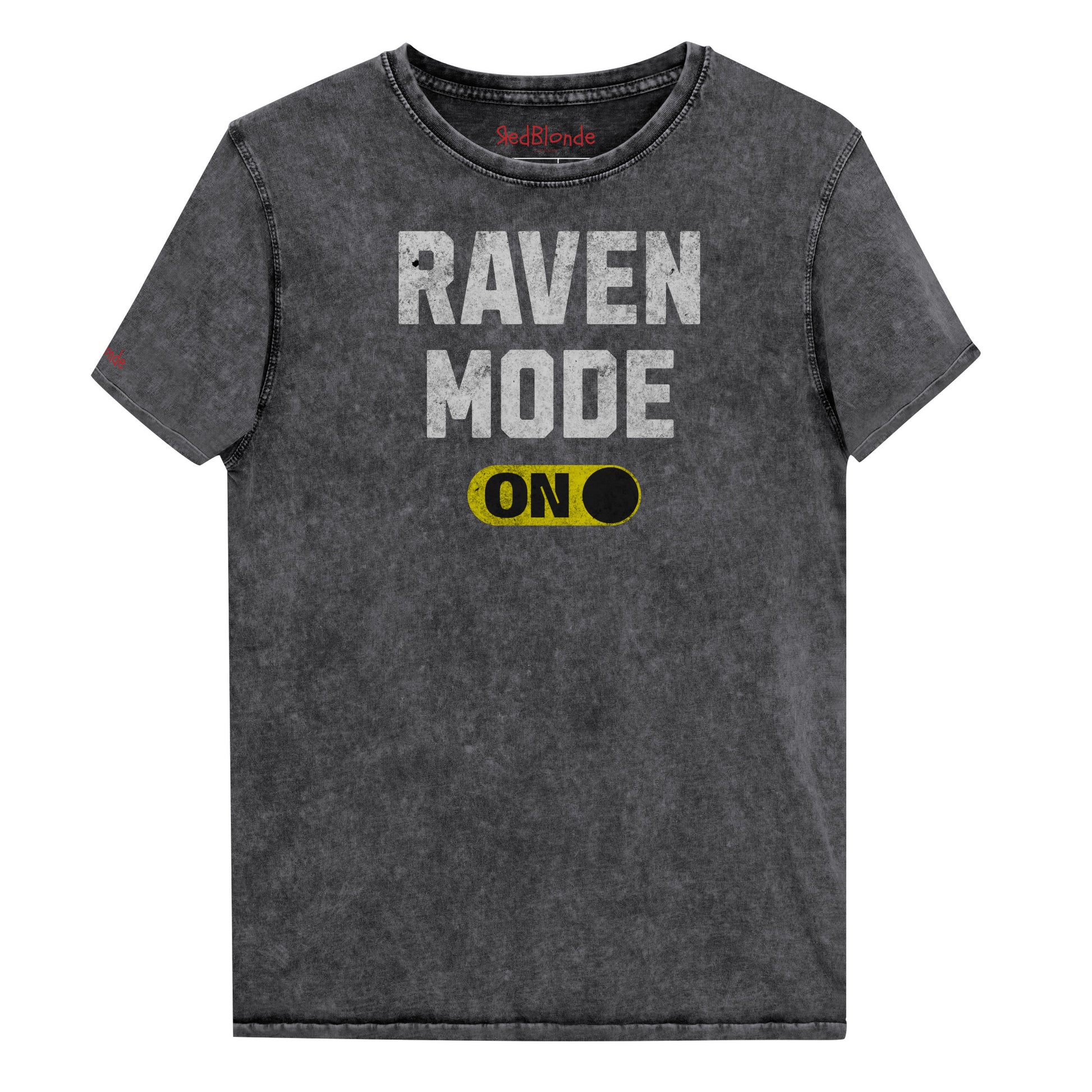 black denim-style unisex t-shirt with bold distressed white Univercity font reading “Raven Mode” and a yellow on/off switch graphic in the “On” position beneath. The design includes subtle worn texture for a vintage look. Branded RedBlonde London in red on inside neck and right sleeve