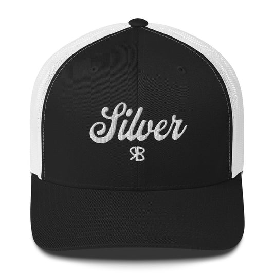 black/White trucker cap with 'Silver' in white adventurer 01 font on front. Mesh back. Branded RB