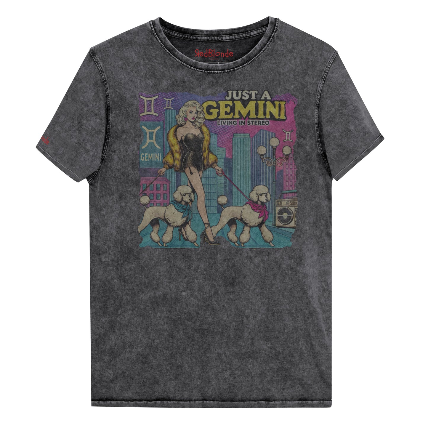 Flatlay of a unisex black denim wash vintage t-shirt with a retro pop-art Gemini graphic featuring a blonde woman, in a short catsuit and fur coat walking two poodle dogs with neck scarfs with a city backdrop and a gettoblaster ‘Just a Gemini, Living in Stereo'. Branded RedBlonde on inside neck and right shoulder