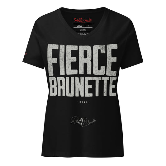 black women’s V-neck T-shirt featuring the bold black distressed text “FIERCE BRUNETTE” in large North Road capital letters across the chest. Beneath the text, the year “2025” is printed in small type, with the “RedBlonde” brand signature logo below it. The inner collar shows the “RedBlonde” brand name in red along with sizing and care details, and “RedBlonde” is also printed in small red letters on the right sleeve.