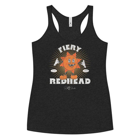 black women’s racerback tank with a bold retro graphic of a smiling orange cartoon sun character, surrounded by radiant sunbeams. The text reads ‘Fiery Redhead’ in distressed white Belzebuth lettering with small details including ‘ESTD 1994’ and the RedBlonde signature logo beneath."