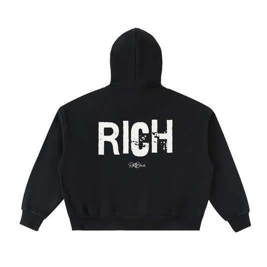 Black oversized hoodie with a large white distressed “RICH” in Ed Gein graphic across the back and a small RedBlonde logo underneath.