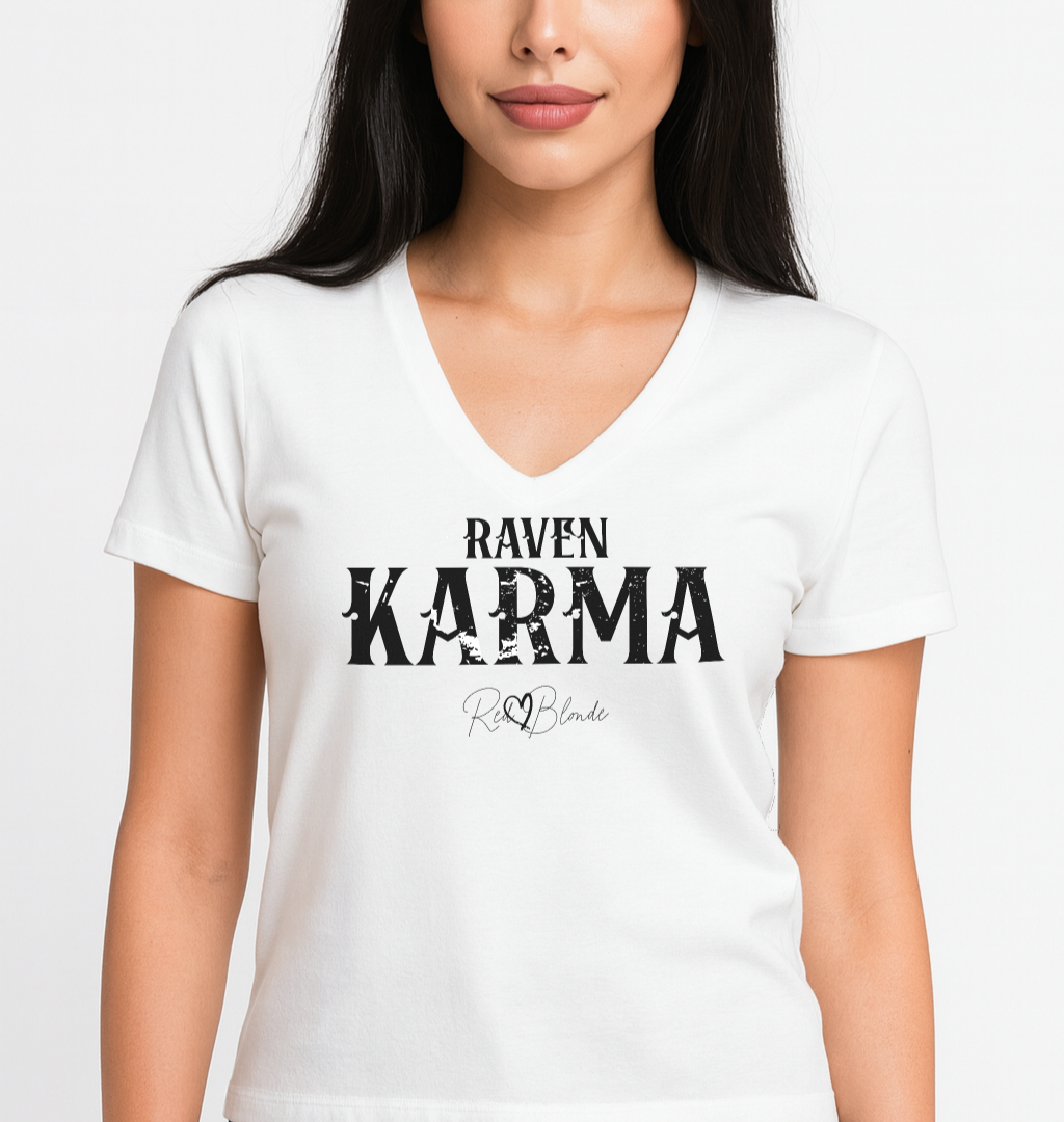 black haired model wears white v-neck women's relaxed fit t-shirt with 'RAVEN KARMA' in Aquero white font, signed RedBlonde. Branded RedBlonde in red on inside neck and right sleeve 