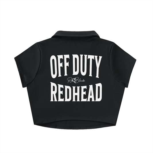 Black cropped polo shirt with large white “OFF DUTY REDHEAD” Brookfield text on the back and a small RedBlonde script logo beneath.