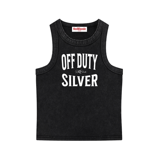 A black sleeveless vintage acid wash tank top laid flat on a white background, with white text on the chest reading “OFF DUTY SILVER” in bold Brookfield lettering, and a small cursive RedBlonde signature logo between the words. 