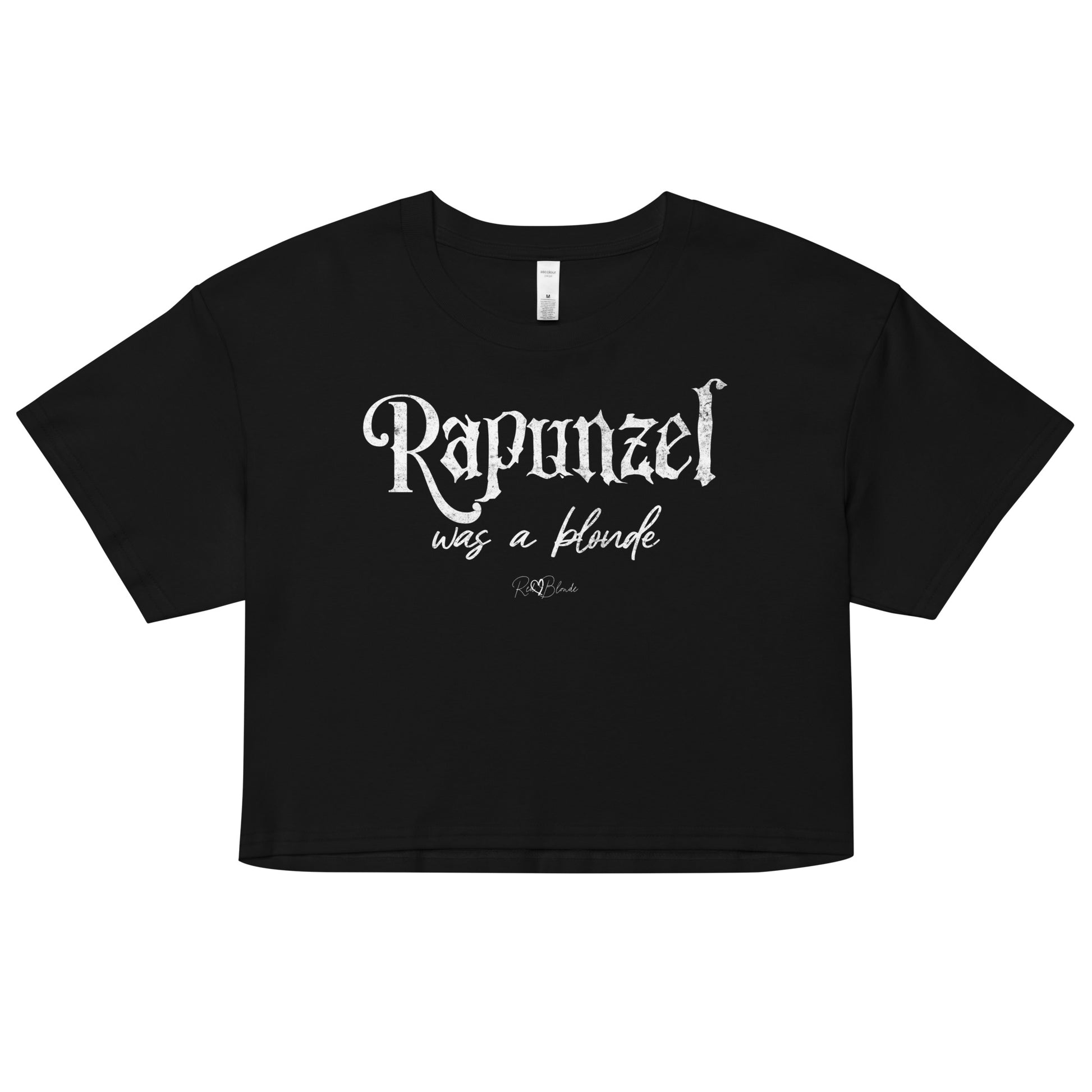black women’s crop top featuring black fairytale spiky text that reads “Rapunzel" and the phrase “was a blonde” written underneath in an elegant cursive script. signed off with the RedBlonde heart signature logo