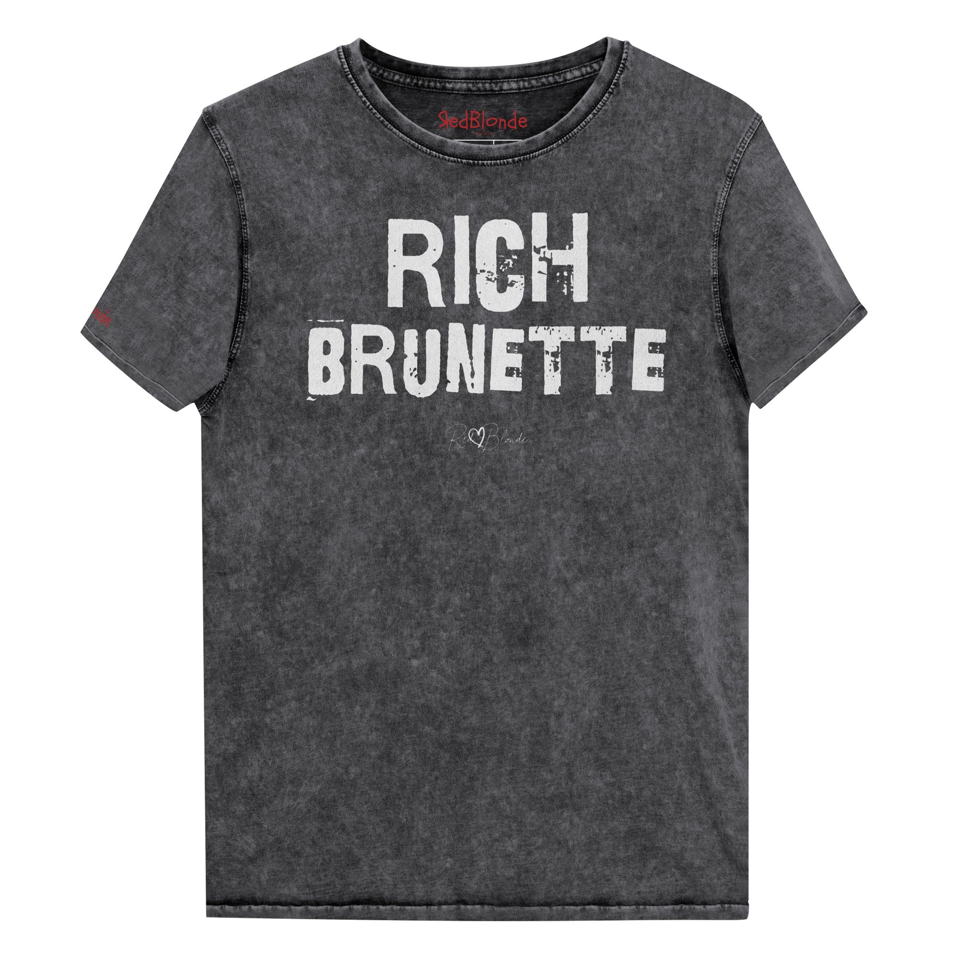 a black acid-wash unisex denim T-shirt with a distressed vintage look. The shirt features the bold white text “RICH BRUNETTE” in a weathered Ed Gein font, and features the RedBlonde signature logo. The shirt has short sleeves, a crew neckline, and visible seam detailing for a rugged, casual style. Branded Redblonde on inside neck and right sleeve