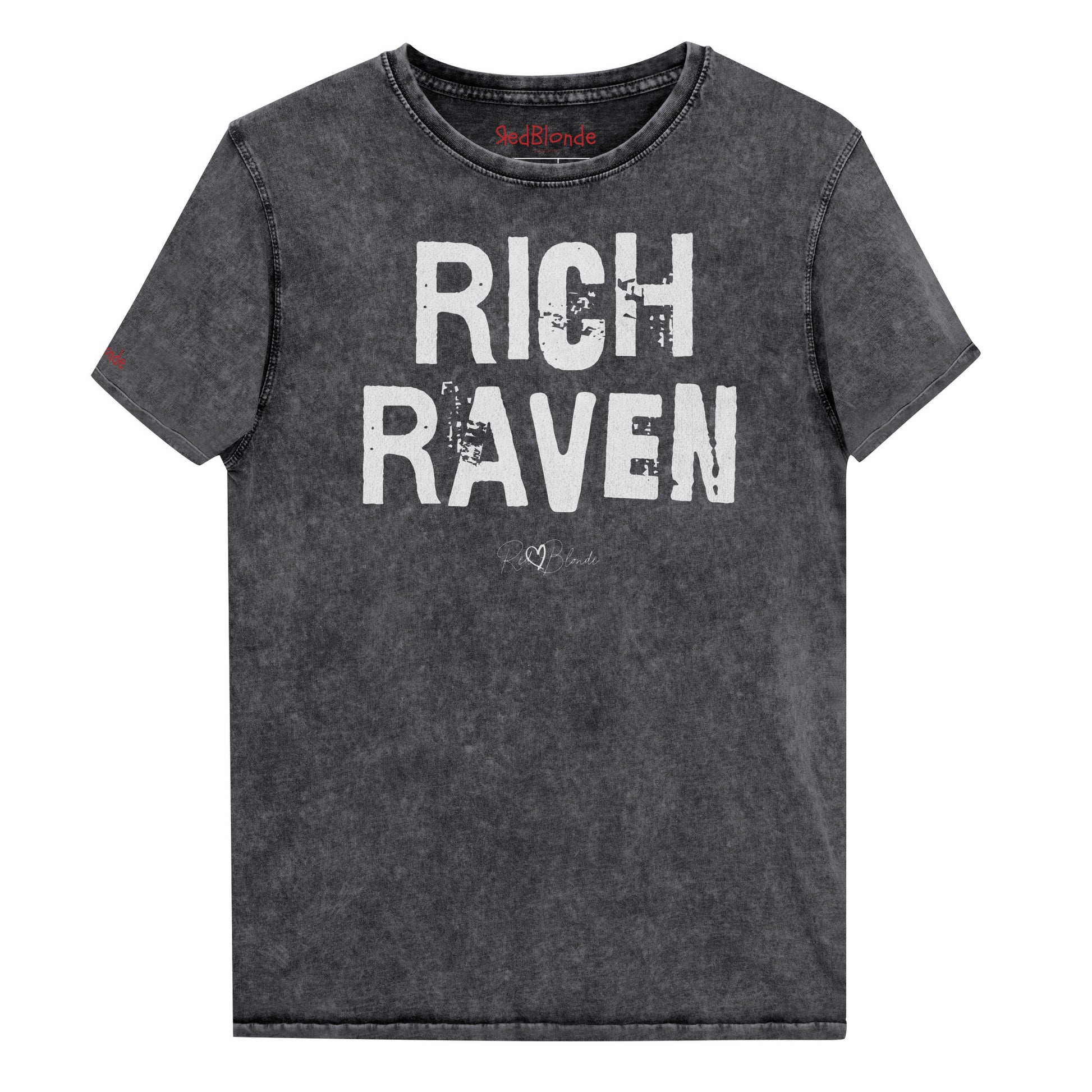 a black acid-wash unisex denim T-shirt with a distressed vintage look. The shirt features the bold white text “RICH RAVEN” in a weathered Ed Gein font, and features the RedBlonde signature logo. The shirt has short sleeves, a crew neckline, and visible seam detailing for a rugged, casual style. Branded Redblonde on inside neck and right sleeve